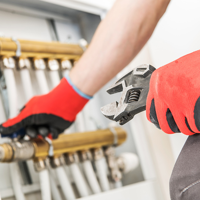 technician reapiring cooling system pipes vienna va